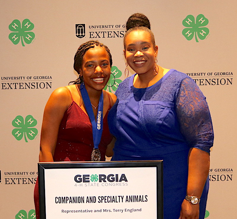Georgia 4-H member Tandria Burke of Dougherty County was among the 4-H'ers who earned the title of Master 4-H'er during Georgia 4-H State Congress held July 23-26 in Atlanta. Burke competed in the Companion and Specialty Animals category. She is shown (left) with University of Georgia Cooperative Extension 4-H Agent for Dougherty County Jazmin Thomas.