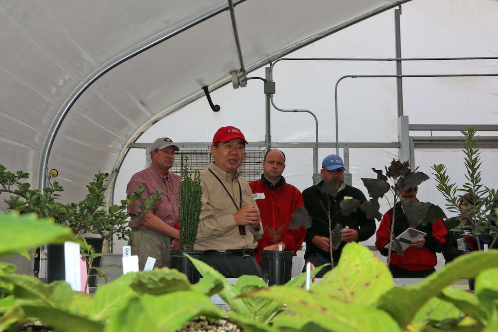 UGA horticulture Professor Donglin Zhang shows a group around his greenhouse at the Durham Horticulture Farm in Watkinsville during a past farm tour. The 2019 Horticulture Farm Tour will be held on Oct. 4 at 1221 Hog Mountain Road.