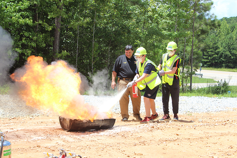 My PI Georgia training in Haralson County included practicing putting fires out.