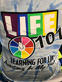 Shirt design for the Life 101 Conference in 2019 resembles the classic game "Life."