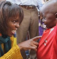 The former executive director of the United Nations World Food Programme, Ertharin Cousin, talks to a boy in the Central African Republic during her visit in late March 2014. Photo by World Food Prize. Not for reuse.