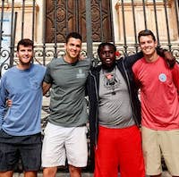 College of Agricultural and Environmental Sciences students Chad Cain, Sam Bignault, Joshua Toran and Logan Waldrop pose in front of a cathedral in Malaga, Spain, during the Spain: Food Production, Culture and the Environment study abroad program in 2019.