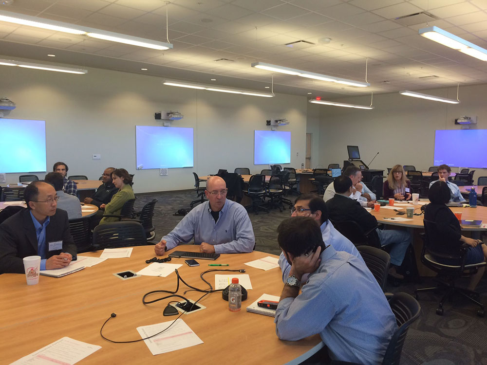 John Peroni at a Regenerative Bioscience Center research roundtable meeting. Seated at the table are, left to right, Hitesh Handa, John Peroni, Lohitash Karumbaiah and Jason Locklin.