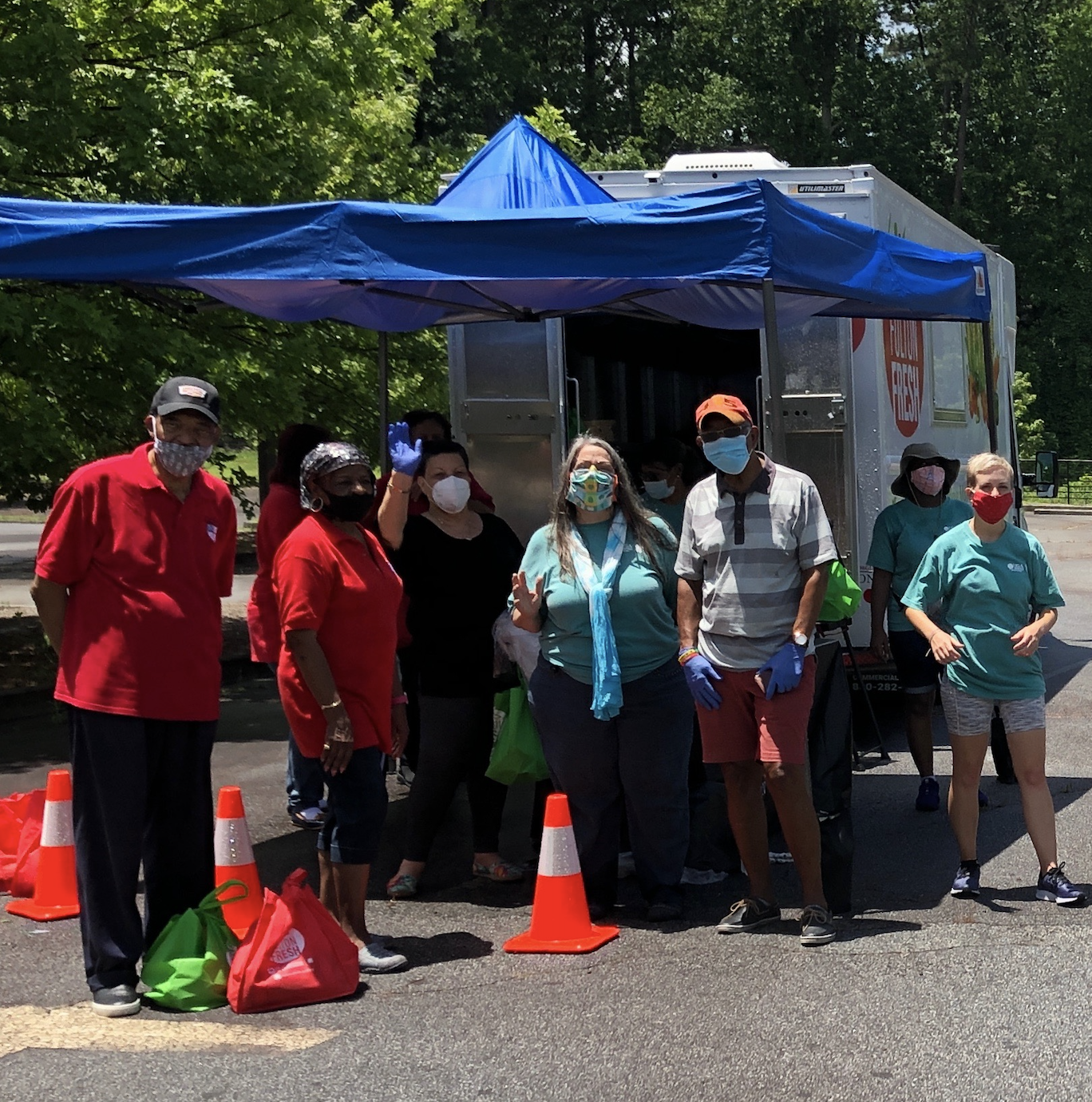 Fulton County Extension staff and volunteers prepare to distribute produce bags through curbside pickup at a Fulton Fresh mobile market stop in Atlanta. (Photo by Molly Woo)