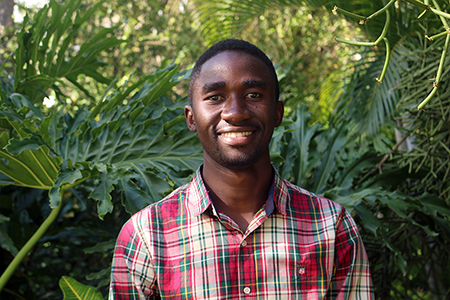 Ivan Chapu has worked with hand-held sensors in groundnut test plots in Uganda as past of a three-country project to use the technology for high-throughput phenotyping. Now that he’s completeing a master’s degree from Makerere University, he hopes to continue on to a PhD. (Photo by Allison Floyd)