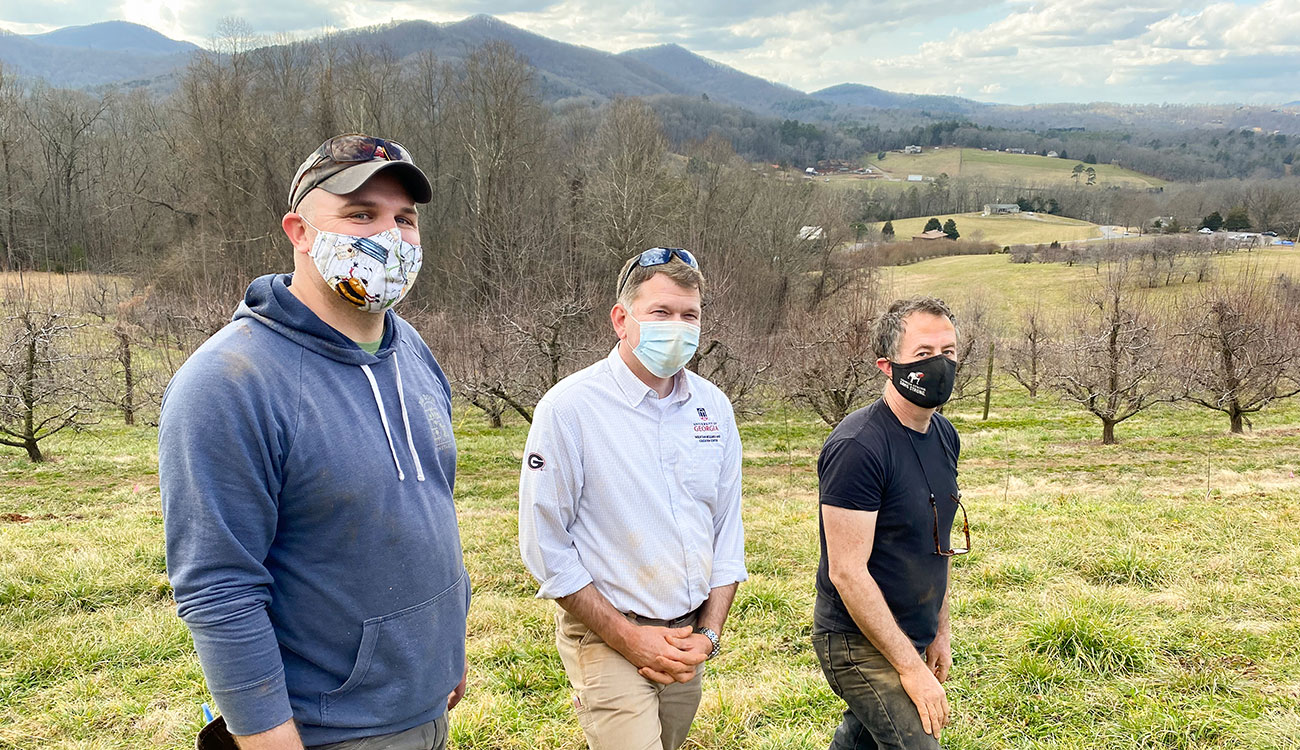 From left, Josh Fuder, Ray Covington and Stephen Mihm have been UGA’s driving forces behind the creation of the Heritage Apple Orchard. (Photo by Mike Terrazas)