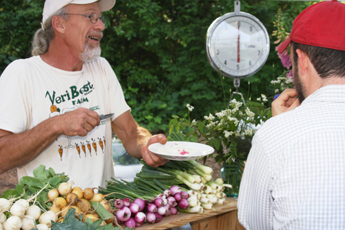 Farmers markets, like this one in Athens, Ga., allow consumers to connect directly with local farmers like Todd Lister of Veri Best Farm. A rising interest in local food has made farmers markets and community gardens popular across the state.