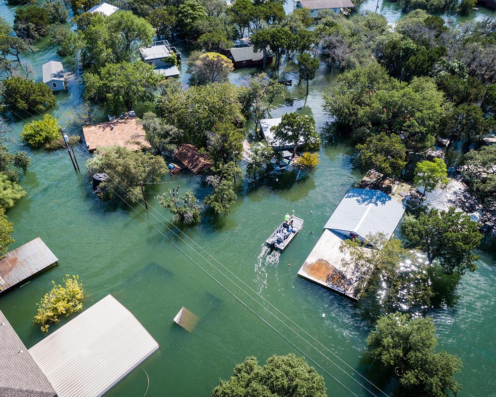 A water rescue crew searches for survivors in Texas after Hurricane Harvey, a devastating Category 4 hurricane that made landfall on Texas and Louisiana in August 2017, causing catastrophic flooding.