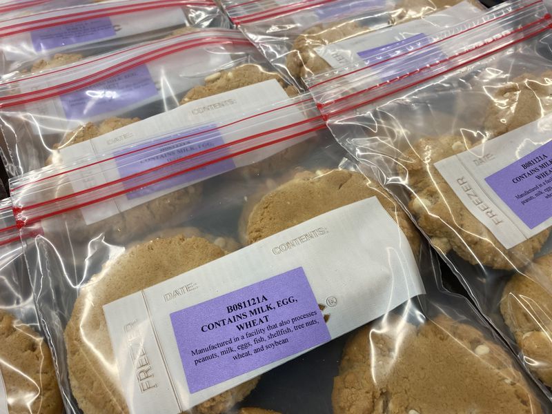 Plastic zipper bags of cookies with allergen and ingredient labels