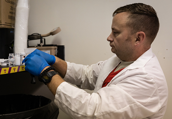 AESL lab manager and analyst David Parks works with water samples to be analyzed for radon contamination.