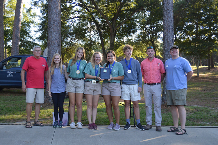 Oconee County's team took first place in this year's state forestry contest. Pictured are (left to right) Henry Walker, owner of Walker Tree Farm; coach April McDaniel, team members Robie Lucas, Lexi Pritchard, Alyssa Haag and Thomas Stewart; Telfair County Agricultural and Natural Resources Extension Agent Colby Royal, and Oconee County 4-H Educator Daniel Queen.