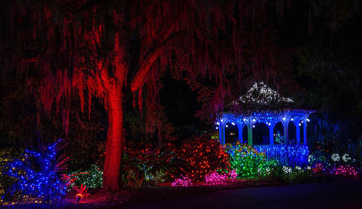 Colorful holiday lights display including a lit-up gazebo