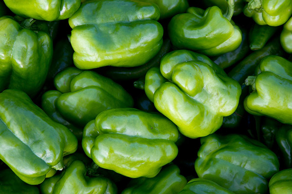 A bunch of green peppers.