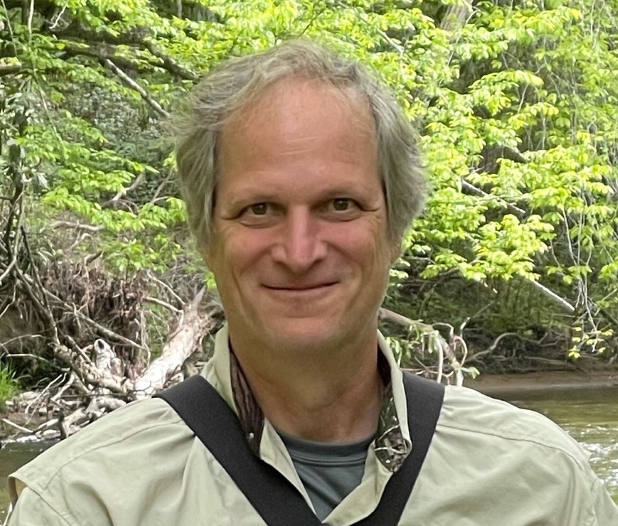 Jeff Mullen in front of a stream or tributary