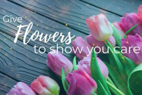 A flower ad featuring tulips and the words "Give flowers to show you care"