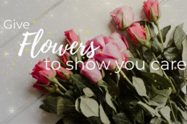 A photo of a bouquet of roses with text over the top that says "Give flowers to show you care"