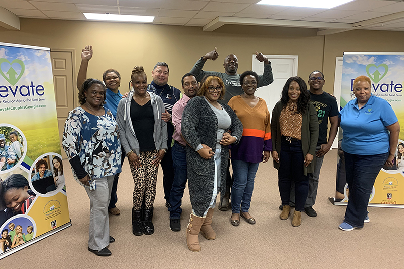 Participants from a fall 2021 ELEVATE workshop in Henry County celebrate completing the program.