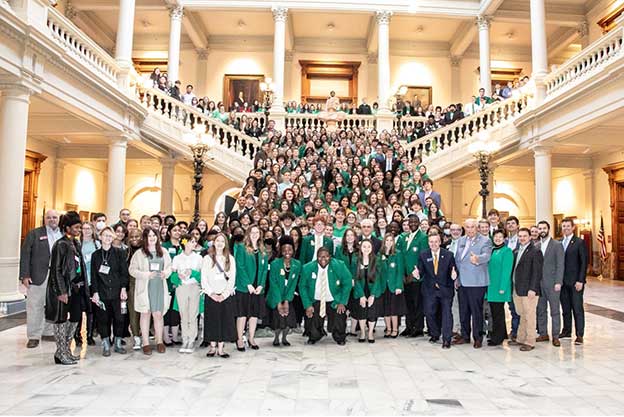 Georgia 4-H’ers gather on the Oglethorpe Staircase in the Georgia Capitol Building with legislators and organizational leaders to celebrate Georgia 4-H Day at the Capitol on February 9.