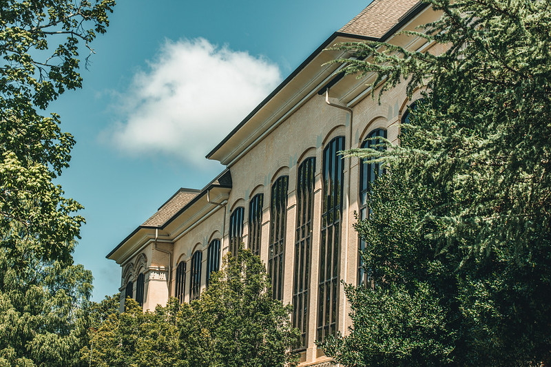 The top of Conner Hall, the CAES administrative building, with blue skies beyond