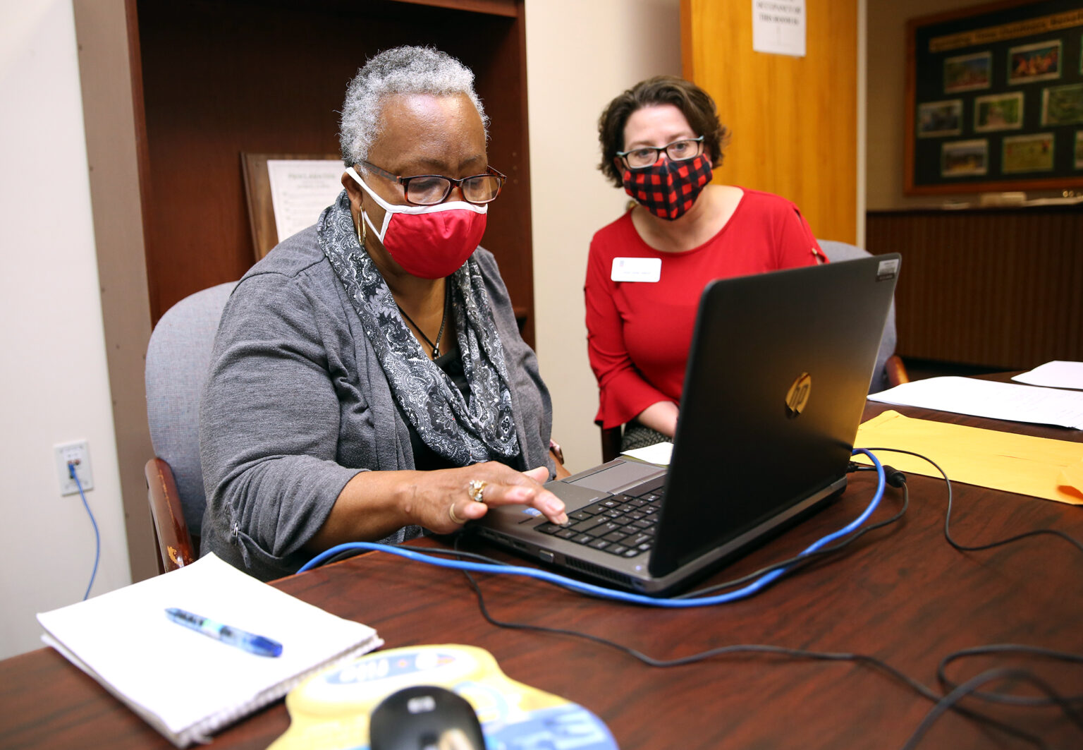 Oconee County resident Hallie Adams (left) works with UGA Cooperative Extension agent Leigh Anne Aaron during a VITA session in March 2021.