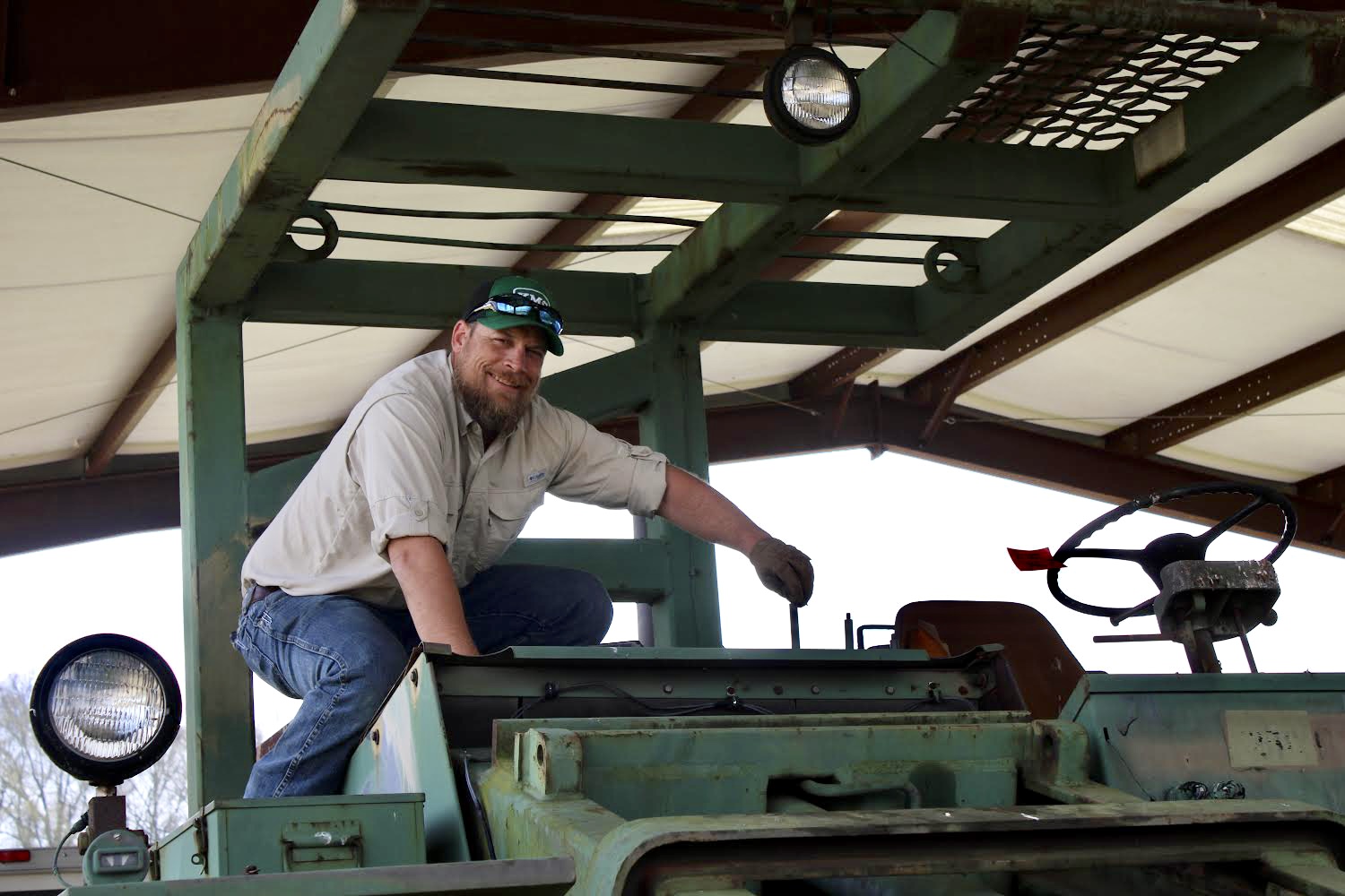 Adam Gregory on a tractor at Westbrook Farm at UGA-Griffin