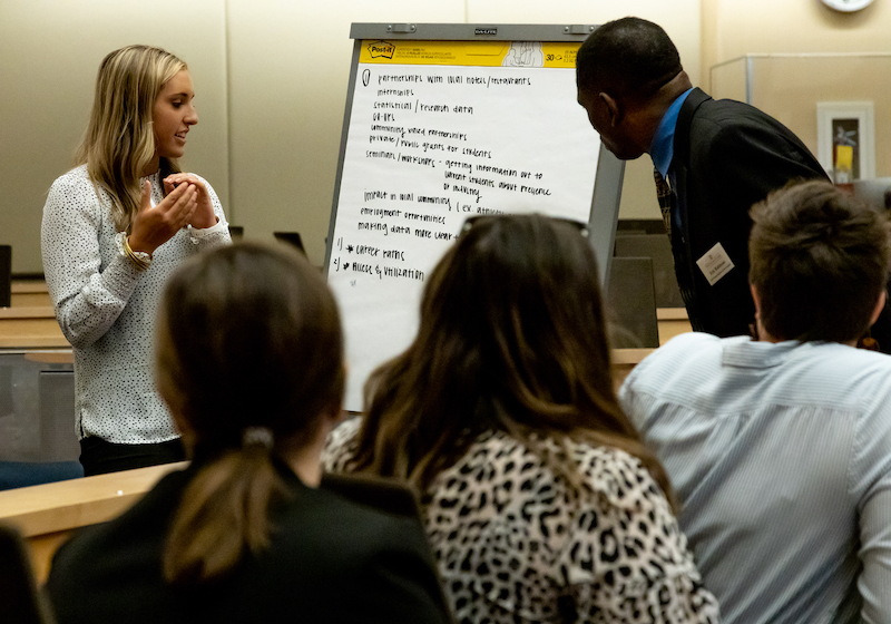 A small group works on an interactive prompt during the summit at the Georgia Center for Continuing Education & Hotel.