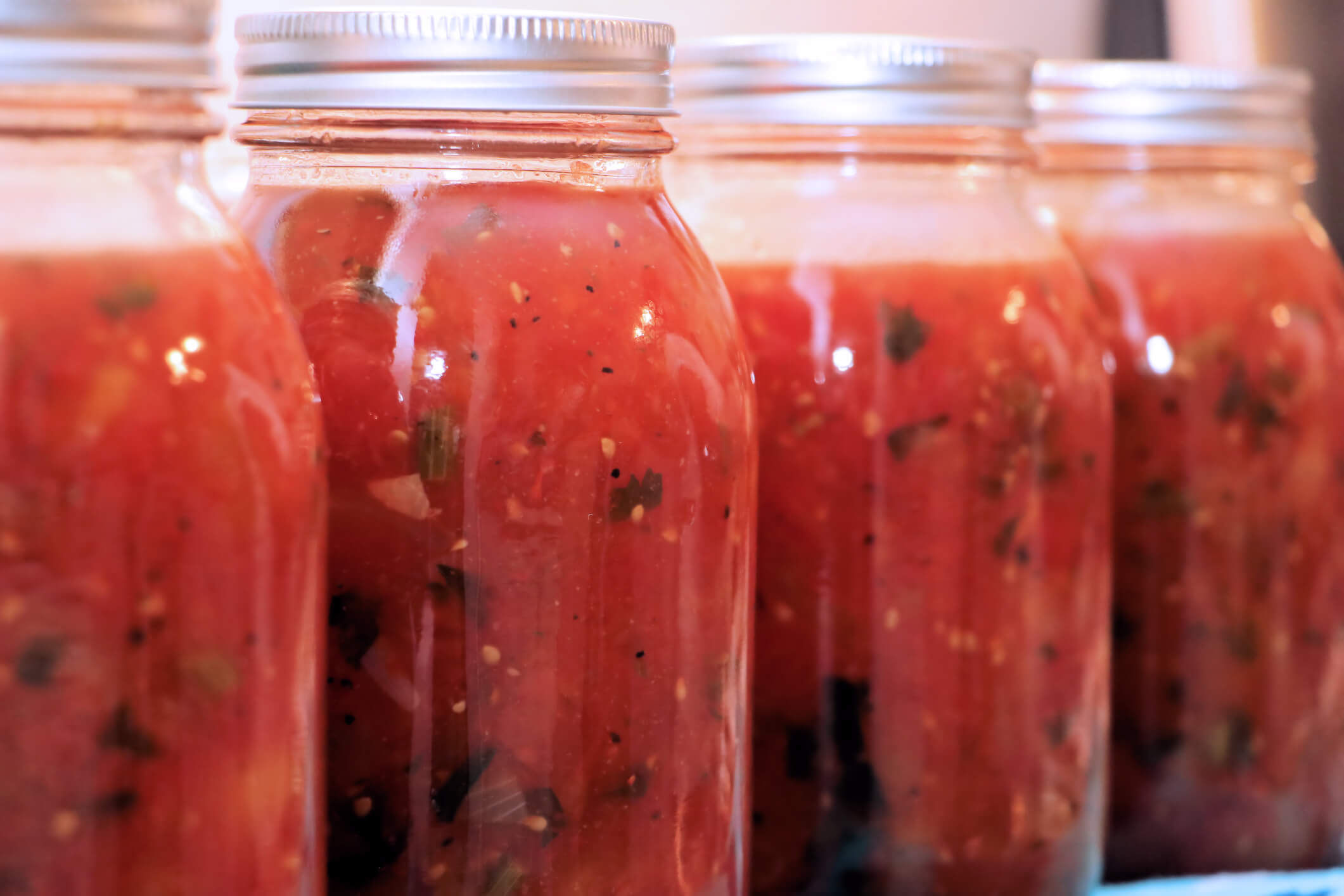 Four cans of canned tomatoes