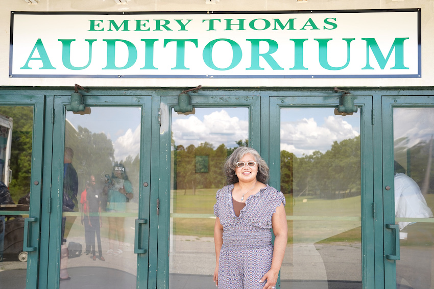 Tonya Thomas Berry stands in front of Emery Thomas Auditorium, named for her grandfather, in Dublin, Georgia. Emery Thomas Auditorium, the historic home of the Dublin 4-H Center, was recently named to the National Register of Historic Places.