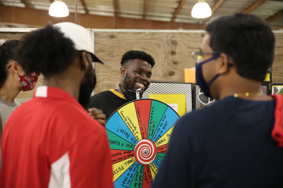 Students at a previous Ag Dawg Kickoff event play a spin-the-wheel game for prizes at the UGA Livestock Instructional Arena.