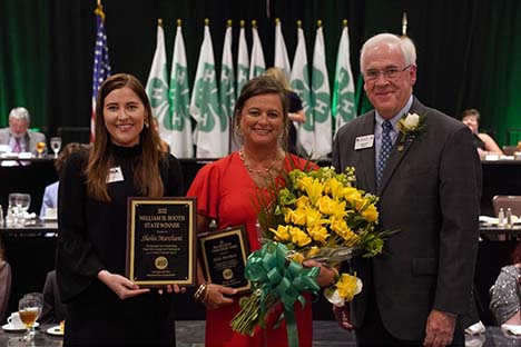 Sheila Marchant (center) received the 2022 William H. Booth Award at Georgia 4-H State Congress. She is pictured here with Jenna Saxon, Government Relations Representative for Georgia EMC (left), and Arch Smith, retired Georgia 4-H State Leader (right).