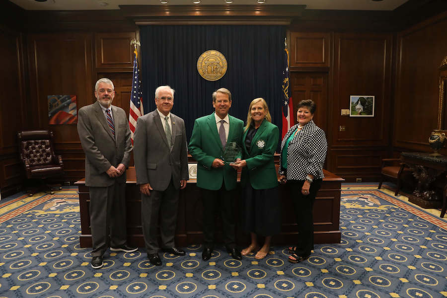 Gov. Brian Kemp and first lady Marty Kemp received the Green Jacket Award for their service to Georgia 4-H. Pictured from left: Dennis Chastain, CEO of Georgia EMC; Arch Smith, retired state leader of Georgia 4-H; Georgia Gov. Brian Kemp, Georgia first lady Marty Kemp; Laura Perry Johnson, associate dean for Extension.