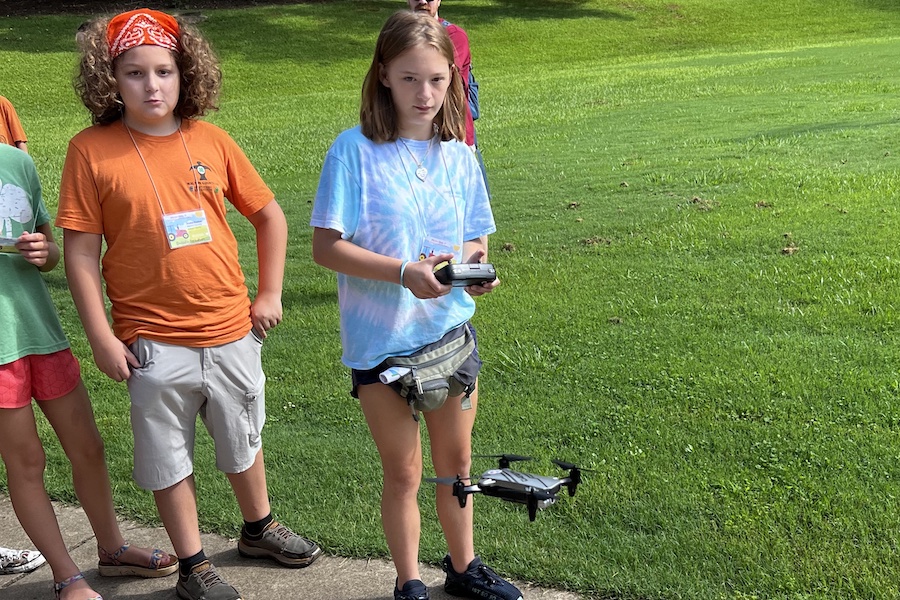 Lexi Collier (right), a seventh-grade 4-H’er from Walton County, learns to fly a drone while fellow 4-H'er Drake Banner waits his turn during Georgia 4-H’s Mission Make-It event at Rock Eagle 4-H Center. 