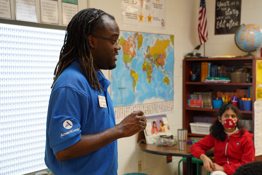 State 4-H Events Coordinator and former Oconee County AmeriCorps member Ke'Marcis Howard teaches young students in a local school classroom.