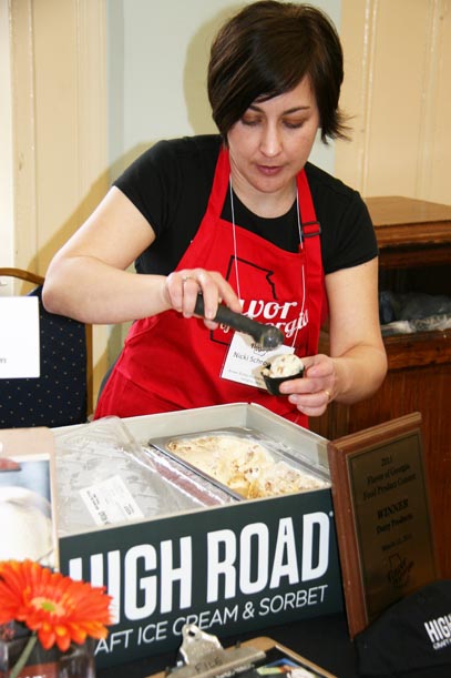 Nicki Schroeder, of High Road Craft Ice Cream in Atlanta, scoops a serving of ice cream for the judges at the 2012 Flavor of Georgia Food Product Contest.