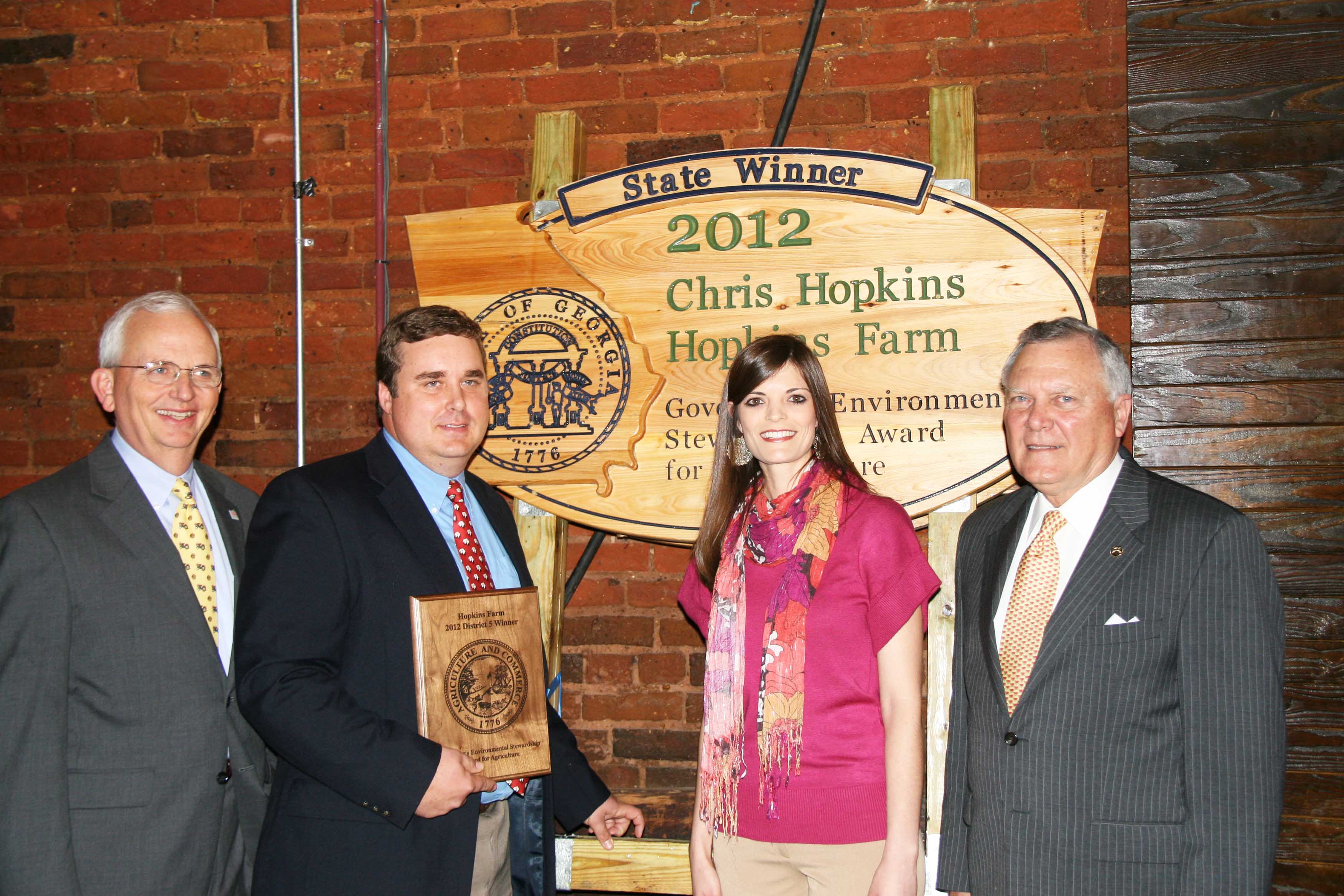 Chris and Marilynn Hopkins, of Lyons, stand with Commissioner of Agriculture Gary Black and Governor Nathan Deal after receiving the 2012 Governor's Environmental Stewardship Award.