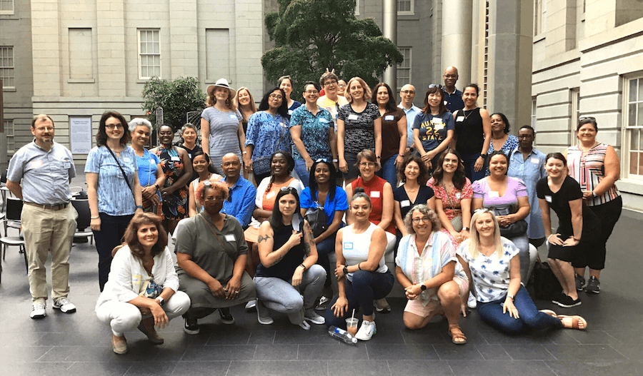 The third cohort of the IAspire Leadership Academy, a large group, gathers for a photo during a team building exercise in Washington, D.C.