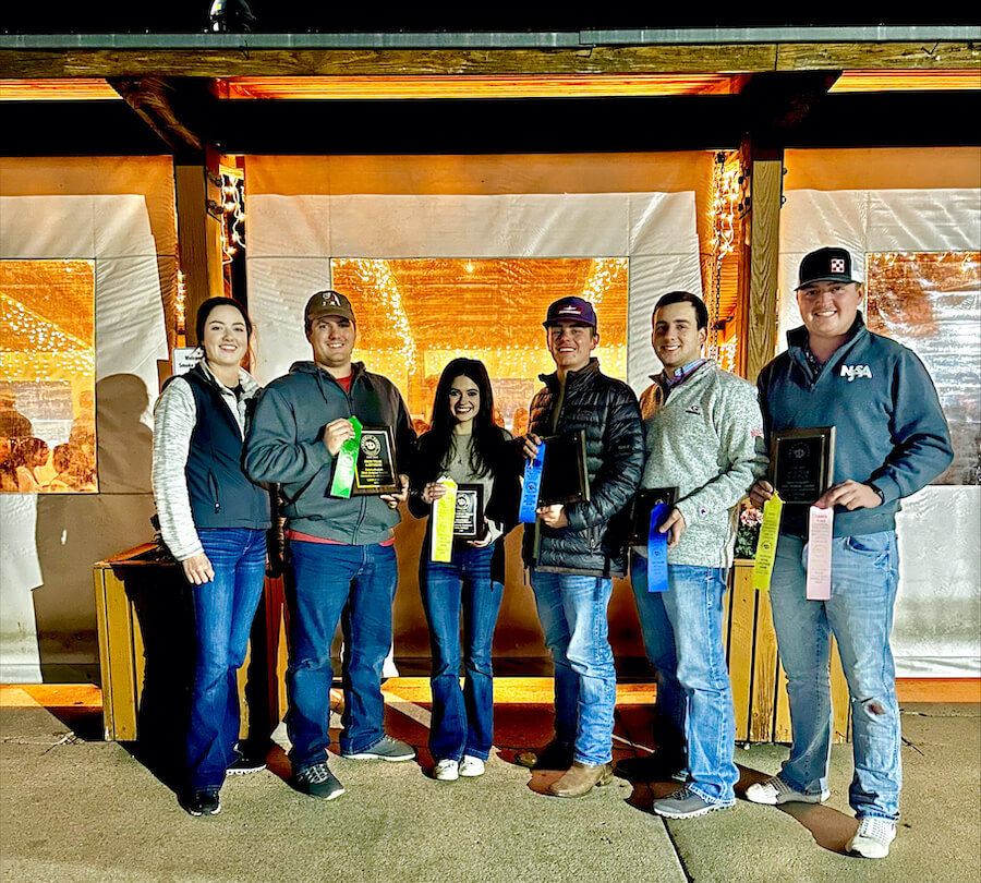 The Meat Dawgs stand outside with their awards after the American Royal meat judging competition in Omaha, Nebraska, in mid-October..