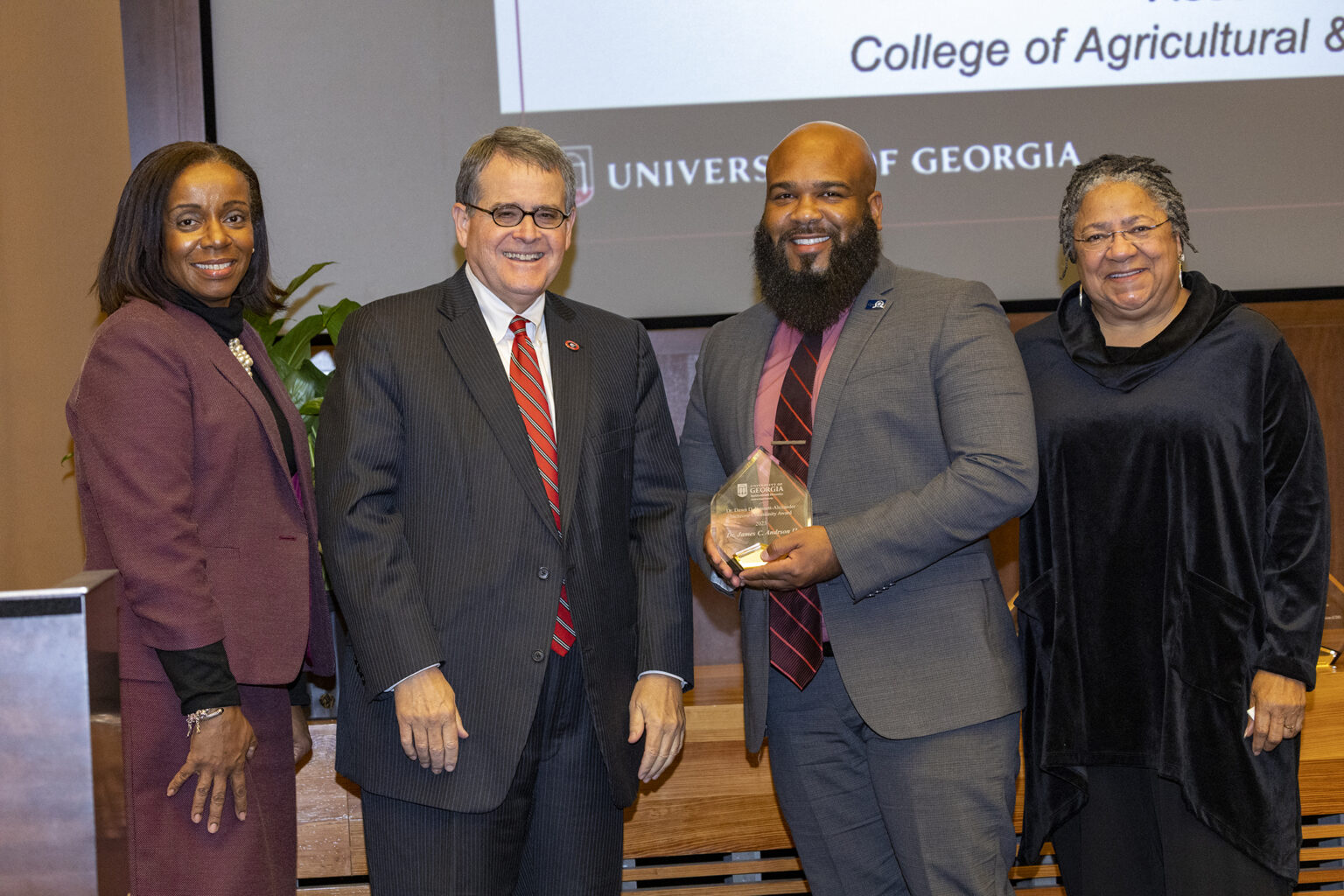 Shown, from left, are Michelle Cook, senior vice provost for diversity and inclusion and strategic university initiatives; UGA President Jere W. Morehead; James Anderson II, recipient of the second annual Dawn D. Bennett-Alexander Award; and Dawn Bennett-Alexander. (Photo by Dorothy Kozlowski/UGA)