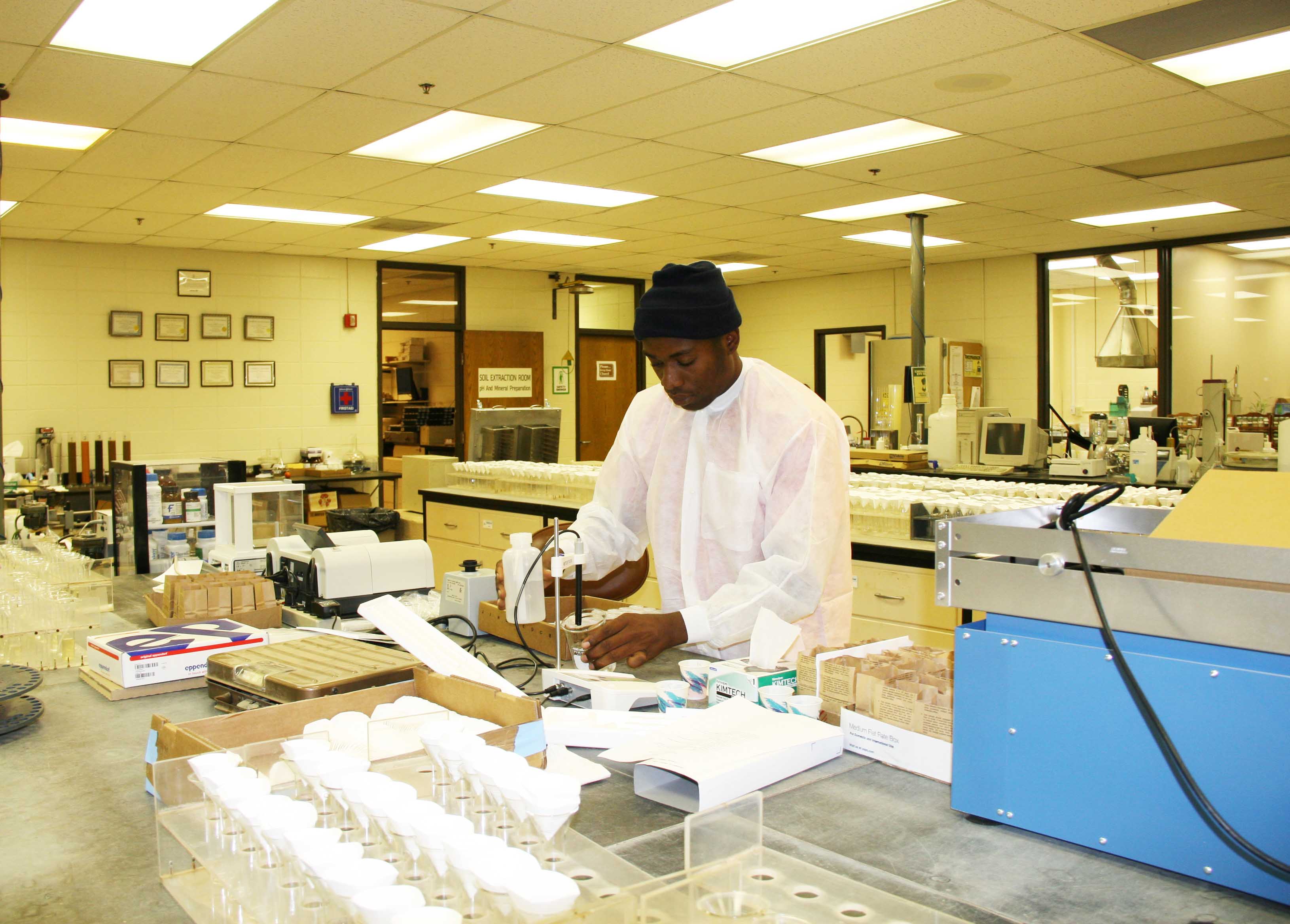 Eddy-Jean Etienne working in the Agricultural & Environmental Services Lab in Athens.