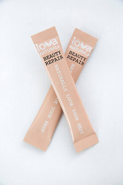 Lova Naturals Beauty Repair stick packs, which come in pale pink packaging