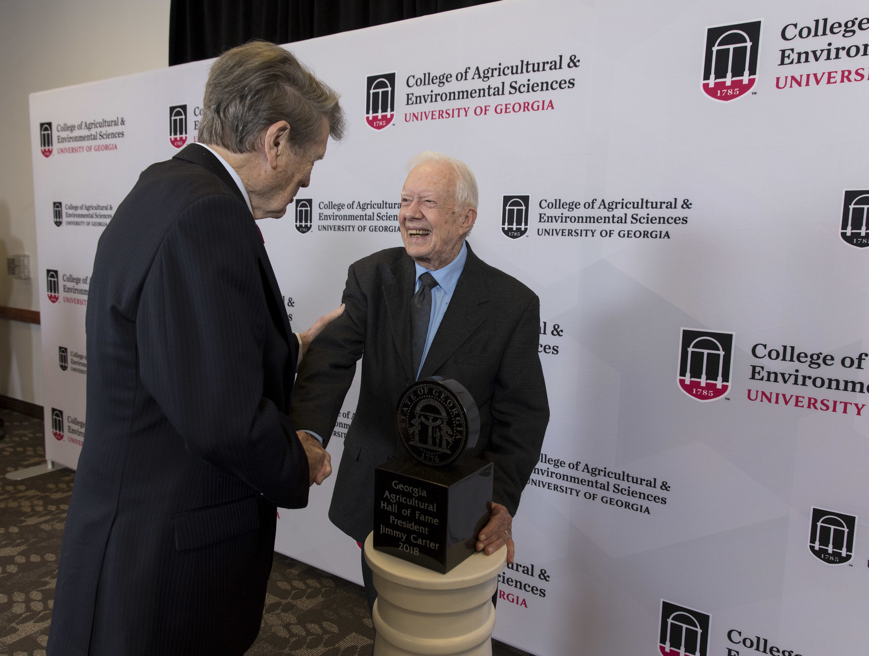 Abit Massey congratulates Former President Jimmy Carter at his induction into the Georgia Agricultural Hall of Fame in 2018.