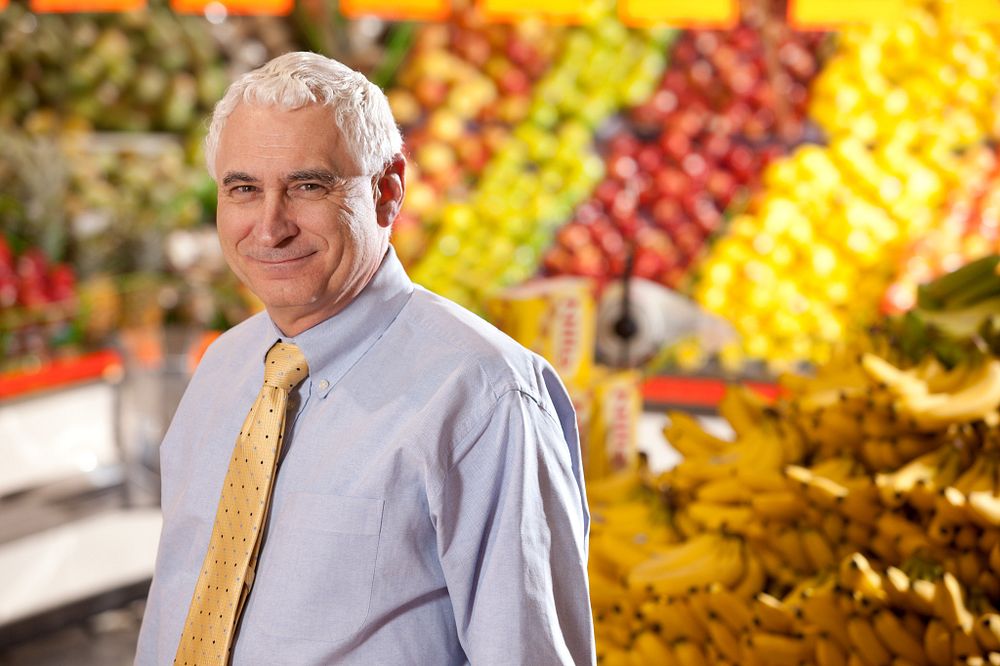 Michael Doyle standing in produce section of a Griffin, Georgia, grocery store.