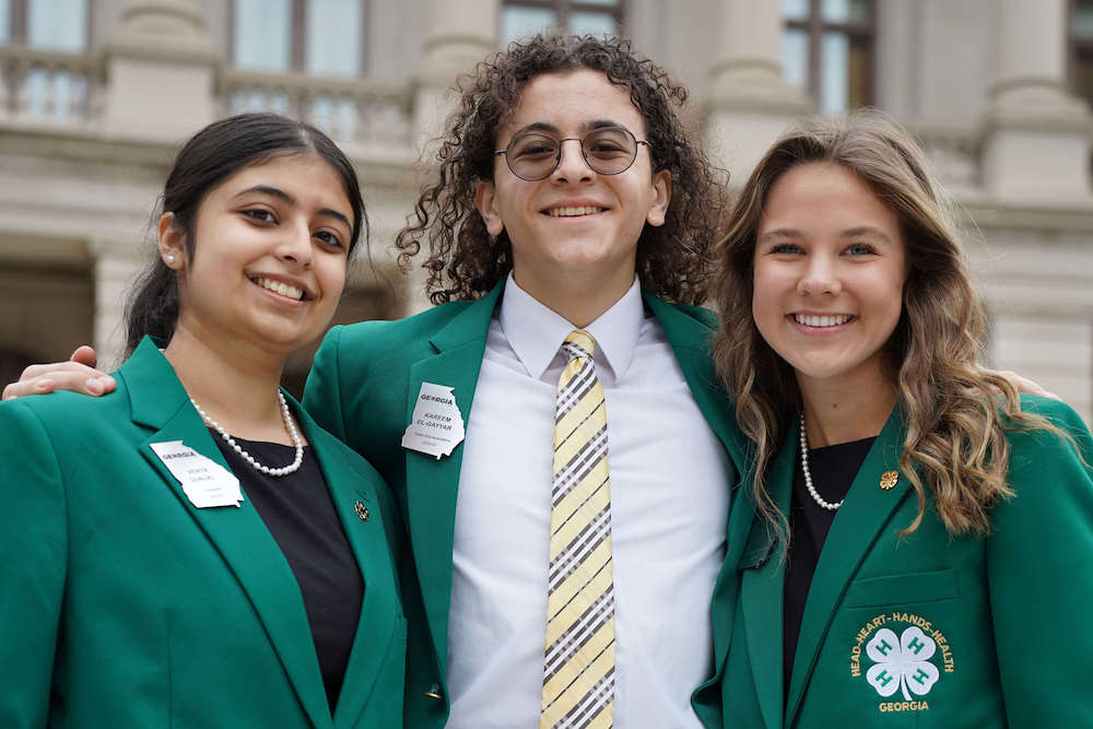 State 4-H officers Venya Gunjal, Kareem El-Gayyar, Hannah Jones get together during 4-H Day at the Capitol. In 2022, all 159 counties received donations during the $4 for 4-H fundraiser. Friends of 4-H have made the initiative a major success each year, easily reaching the 2022 goal of $44,444. The 2023 fundraising goal is set at $54,444. (Photo by Josie Smith)
