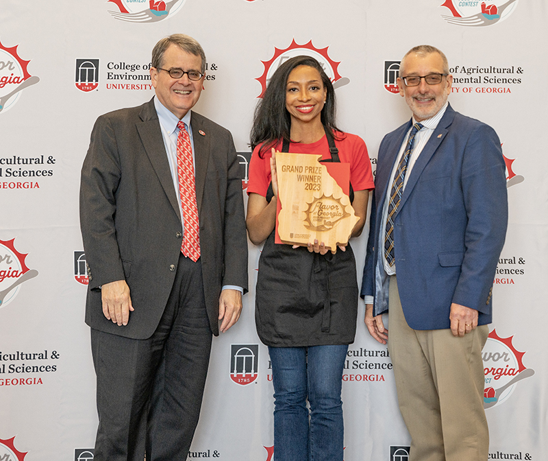 Tiffani Neal, Founder and CEO of Barlow's Foods, with UGA President Jere Morehead and CAES Dean and Director Nick Place at the 2023 Flavor of Georgia food contest.
