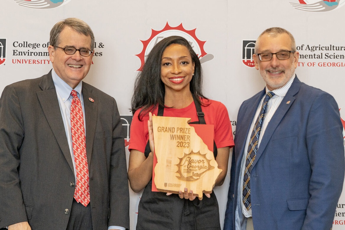 Tiffani Neal, Founder and CEO of Barlow's Foods, with UGA President Jere Morehead and CAES Dean and Director Nick Place at the 2023 Flavor of Georgia food contest.