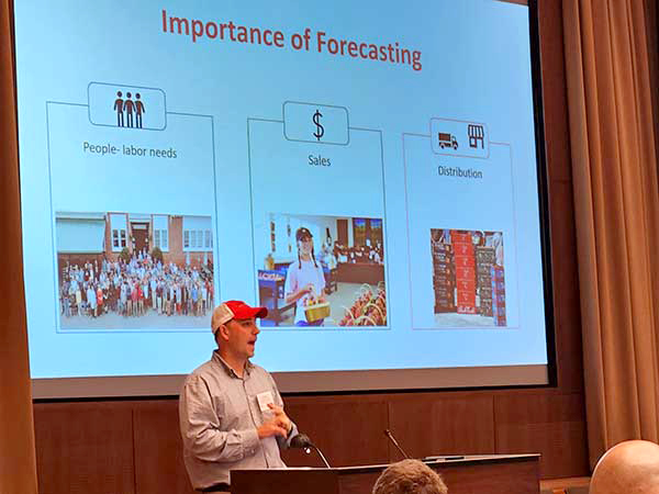Lawton Pearson, owner of Pearson Farm, a peach and pecan producer in Fort Valley, Georgia, describes the laborious process of yield forecasting at the inaugural IIPA conference at UGA.