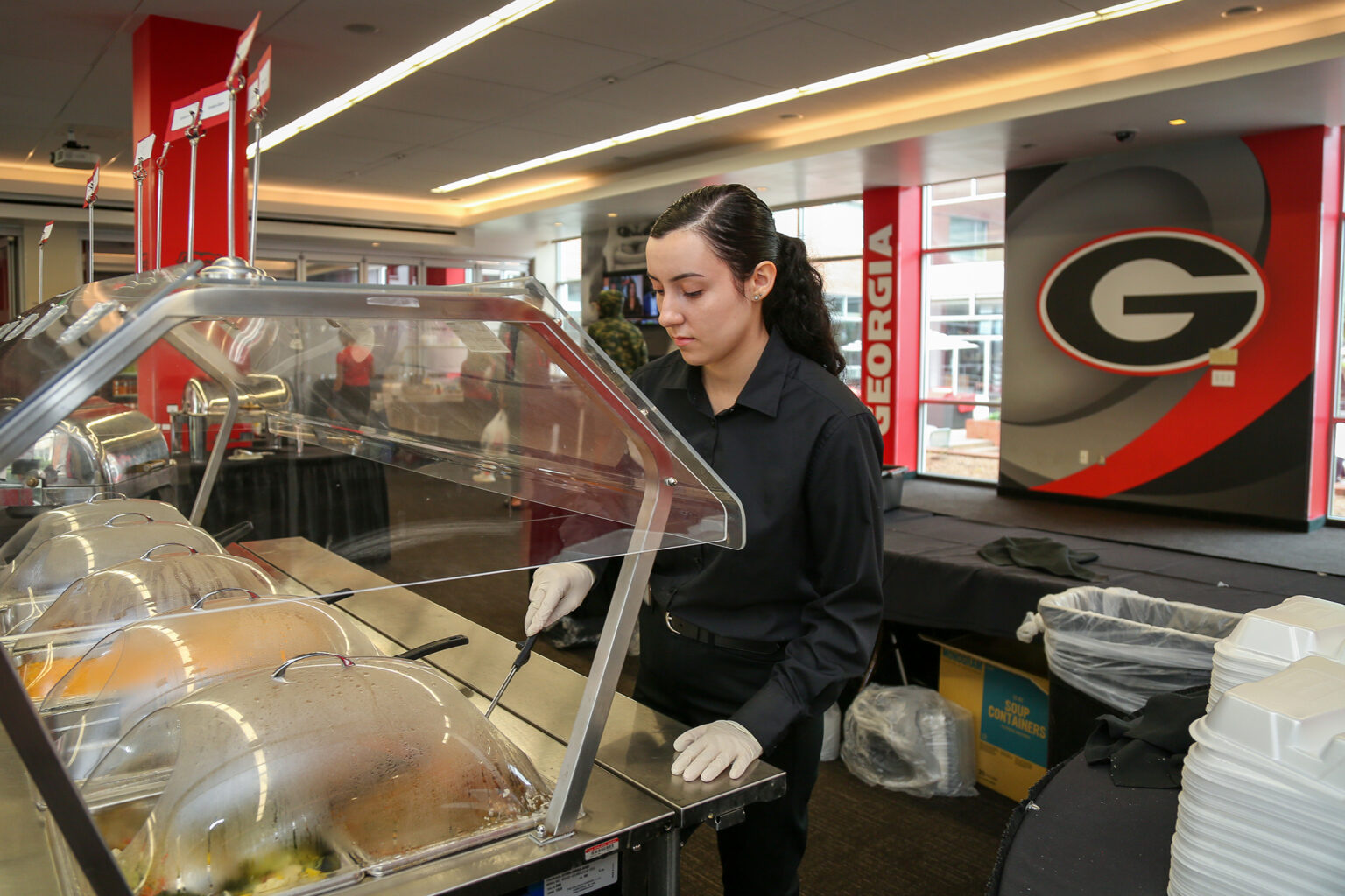 Maya Dubos, a third-year hospitality and food industry management major, works in Dogwood Hall inside the Georgia Center where she spends her internship serving student-athletes. (Shannah Montgomery)