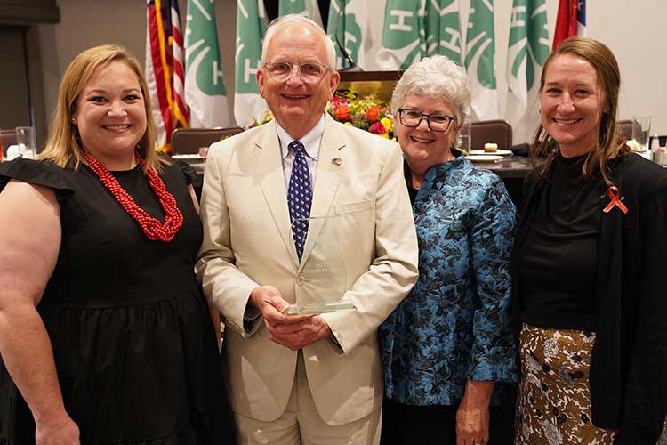 Emanuel County 4-H Agent Jakyn Tyson celebrates the Friend of 4-H Award with recipient Gary Black, his wife, Lydia Black, and Melanie Biersmith.