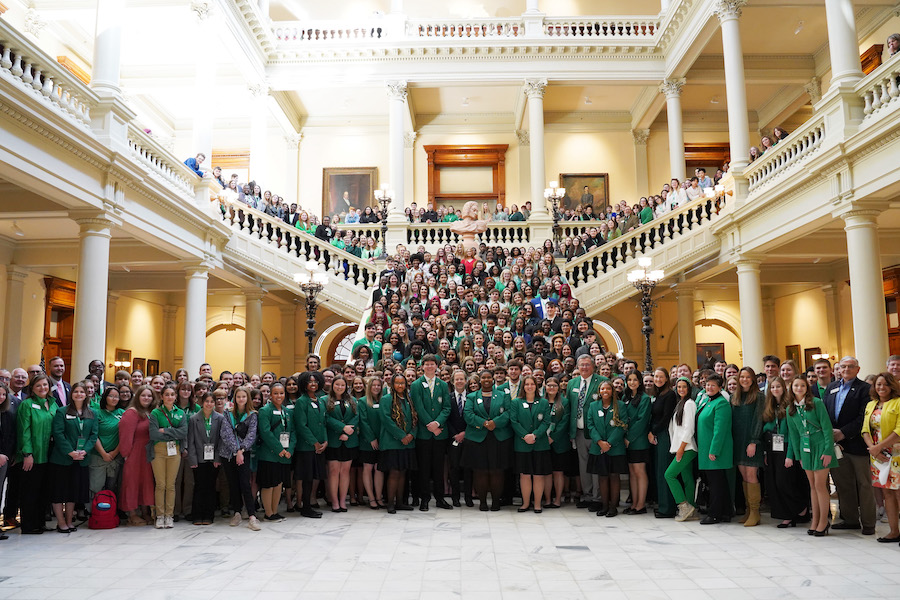 Georgia 4-H’ers gather on the Oglethorpe Staircase in the Georgia Capitol Building with legislators and organizational leaders to celebrate Georgia 4-H Day at the Capitol on February 14, 2024.