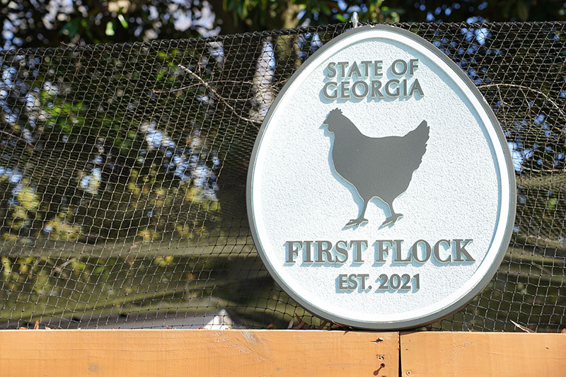 A custom-designed, egg-shaped First Flock sign crowns the coop at the Governor's Mansion.